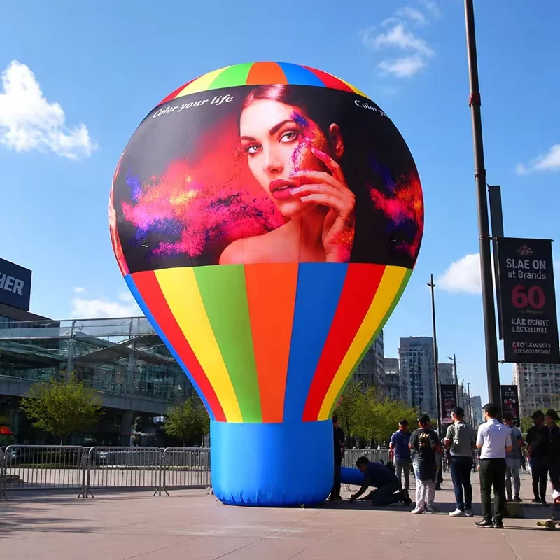 Real hot-air-balloon-shaped inflatable advertising display on a studio background