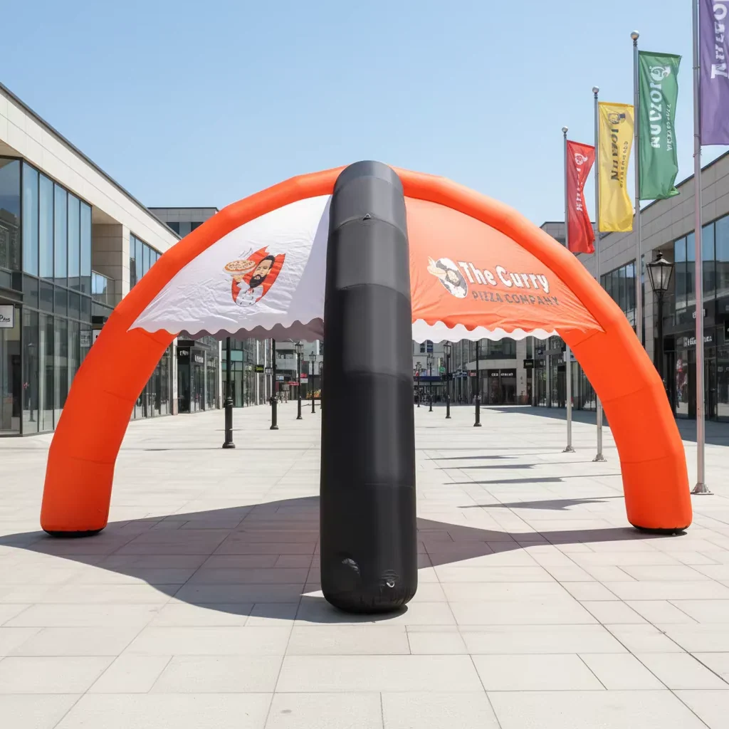 Real four-leg inflatable event tent installed outdoors with printed canopy graphics