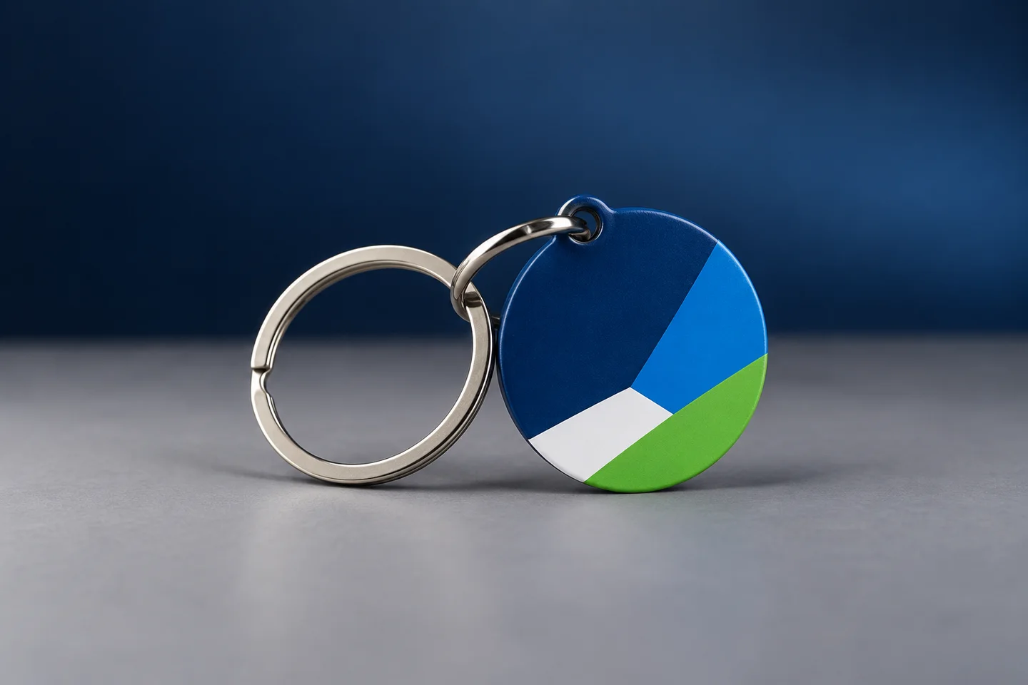 Neutral round custom keychain concept with abstract blue, white and green artwork