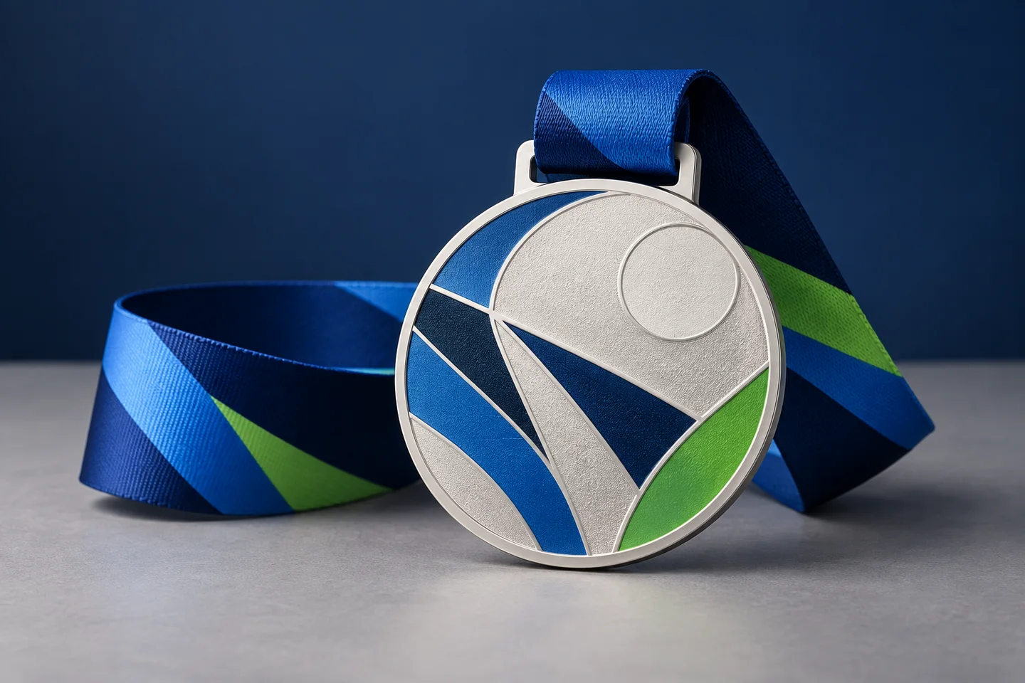 Neutral custom event medal concept with abstract blue, white and green artwork and coordinated ribbon